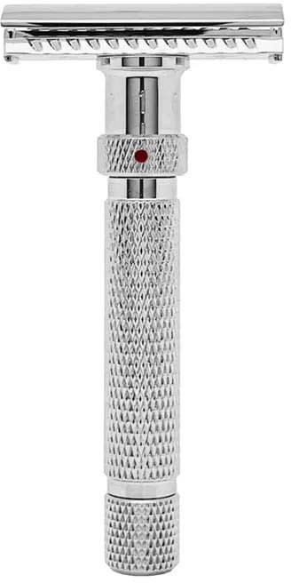 A vintage safety razor with a textured handle and a metal head for shaving.