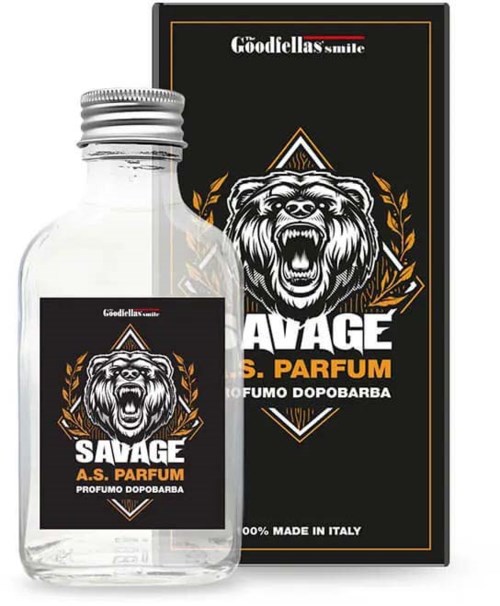 A small perfume bottle with a label showing a roaring bear and the word 'SAVAGE'. It is next to its box with matching design.