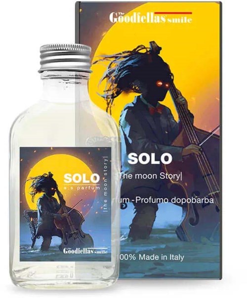A perfume bottle and box featuring a silhouette of a person playing a cello with a moon background.