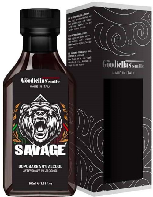 A small brown bottle of Savage aftershave with a lion logo, next to a black box with white swirl patterns.