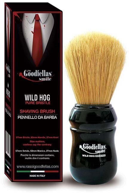 A shaving brush shaped like a wild hog with soft, light-colored bristles in a black handle, next to its box.