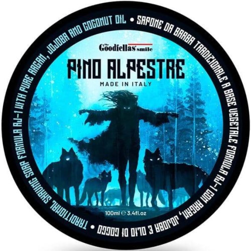This is a round label with a person and dogs in a snowy forest, blue background, and text about a product from Italy.