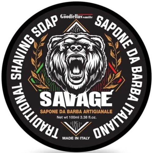 A circular logo with a bear's head roaring, surrounded by text and olive branch designs, promoting a shaving soap.