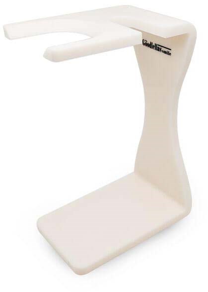 A white device with a flat base, vertical stand, and a horizontal arm extending from the top.