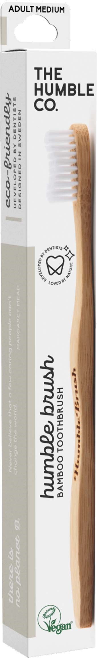 Zahnbürste in Weiß und Beige mit Verpackung mit Labels "The Humble Co" und "Kamboube Brush".