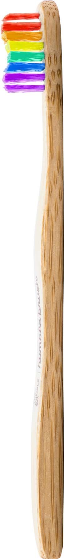 A wooden toothbrush with rainbow-colored bristles on top.