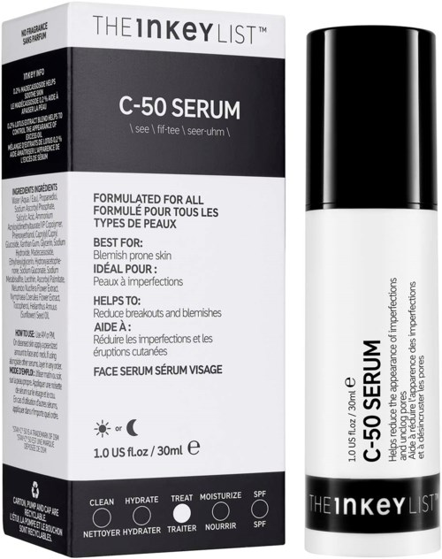 Een huidverzorgingsproductdoos en een zwart flesje met C-50 Serum, eenvoudig, monochroom ontwerp.