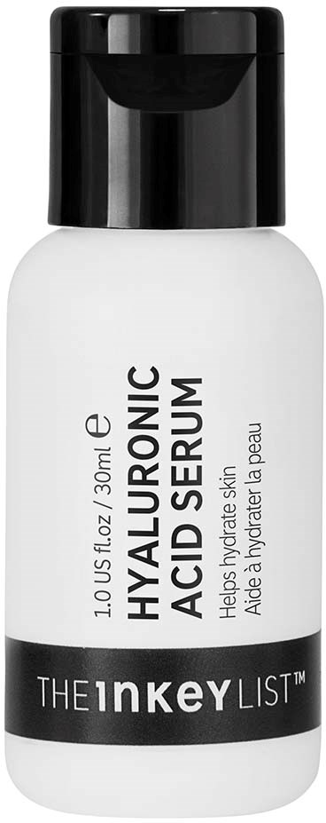 En vit flaska med svart topp märkt 'Hyaluronic Acid Serum' för hudfuktning av The Inkey List.