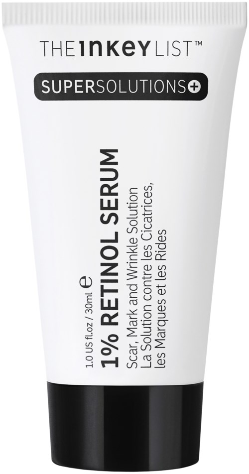 Een tube huidverzorgingsproduct met label 1% Retinol Serum, voor littekens, vlekken en rimpels, met zwarte en witte tekst.