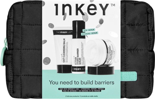 Hoidon setti mustassa vetoketjullisassa tuotteiden ja kortin kanssa, jossa lukee "You need to build barriers."
