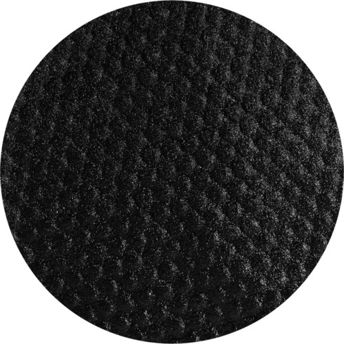 Musta textured ympyrä, jossa on pieniä kiiltäviä hiukkasia pinnalla.
