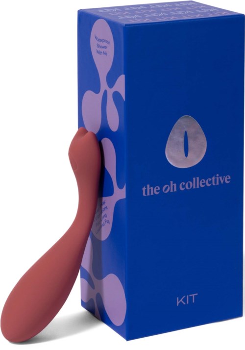 A hand holding a small, pink object next to a blue box labeled "the oh collective KIT."