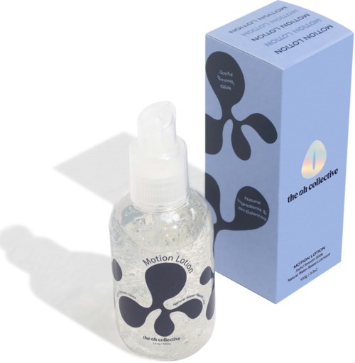 A small transparent spray bottle beside a blue box with black and white abstract designs and text.