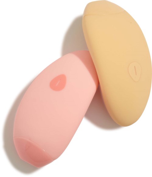 Two oval-shaped pills, one pink with a heart mark and one yellow with a line, on a white background.