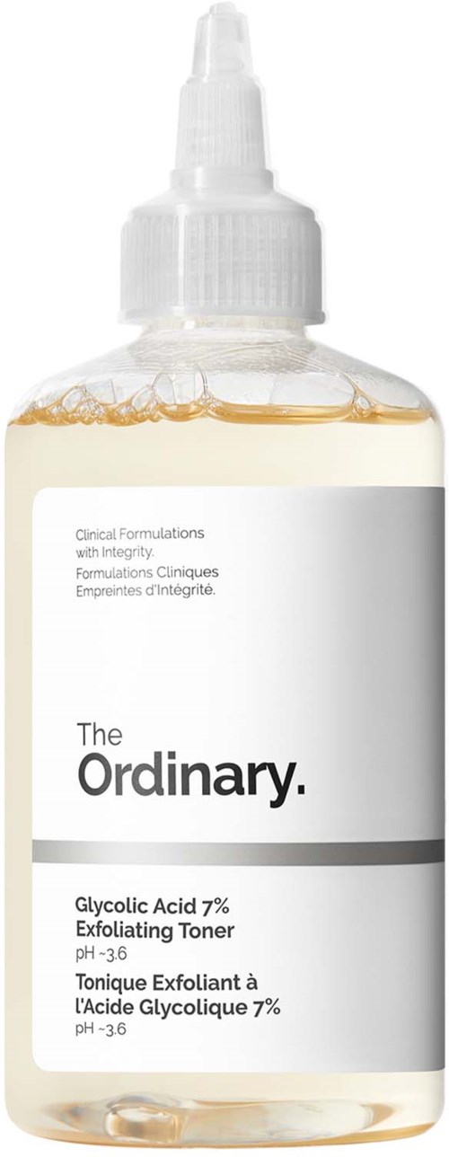 A clear bottle with a white label, containing a light-colored liquid, and a pump top. The label has text about skincare.
