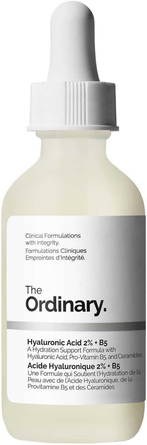 A small white bottle with a dropper, labeled "The Ordinary" and containing hyaluronic acid serum.