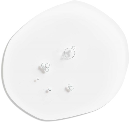 Small bubbles on a white surface, floating and clustered together.