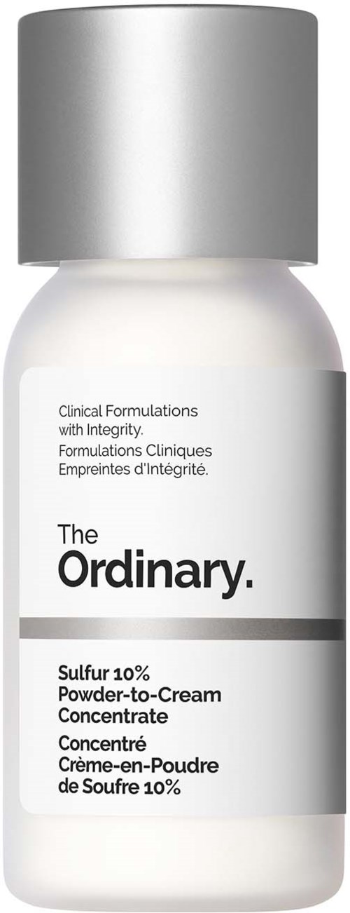 Een witte fles met een zilveren dop, gelabeld als The Ordinary Sulfur 10% Powder-to-Cream Concentrate.