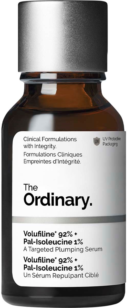 A small brown bottle with a silver cap and a white label, showing product details for skincare.