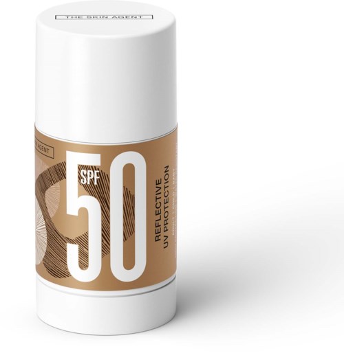 En solskyddsstift med SPF 50, markerat som reflekterande och icke-skyddande, i en vit och guld behållare.