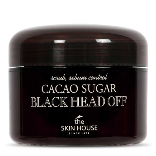 Een zwarte pot met witte tekst die zegt dat het controleert olie en sebum en is voor mee-eters. Het is van The Skin House.