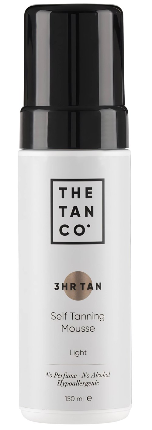 A white bottle with a black cap labeled 'Self Tanning Mousse Light'. It is from THE TAN CO. and has no perfume or alcohol.