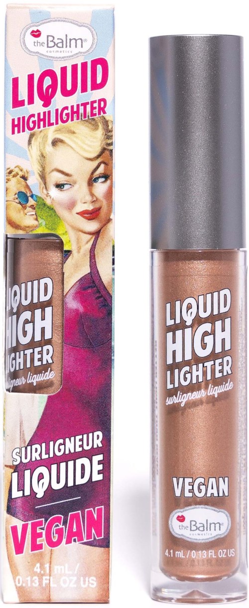 Een doos en een fles vloeibare highlighter van theBalm met een getekende vrouw op de doos. Vegan en stralend.