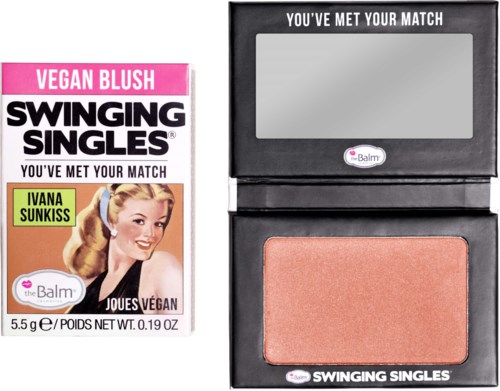 Vegan blush product with a mirror, blush, and packaging featuring a retro woman and text. Limited to 20 words.