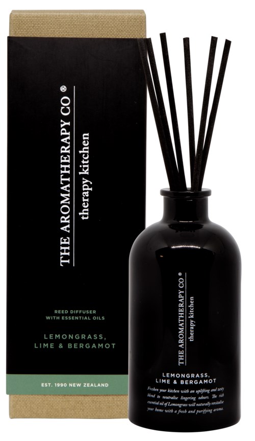 A black diffuser bottle with aroma sticks, box beside it, and label shows lemon grass, lime, and bergamot scent.