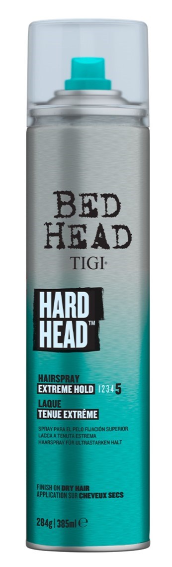 A can of Bed Head TIGI hair spray labeled 'Extreme Hold' for strong hair hold, with a blue spray nozzle.