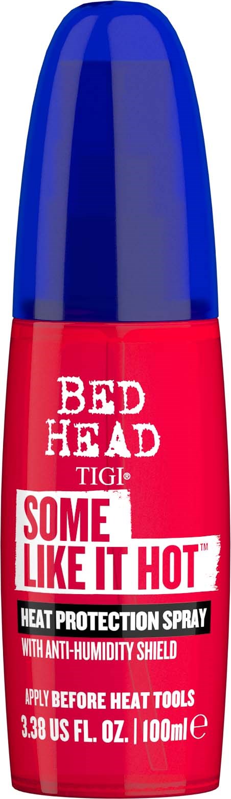 A red spray bottle with a blue cap labeled "Bed Head" and "Some Like It Hot," for heat protection.