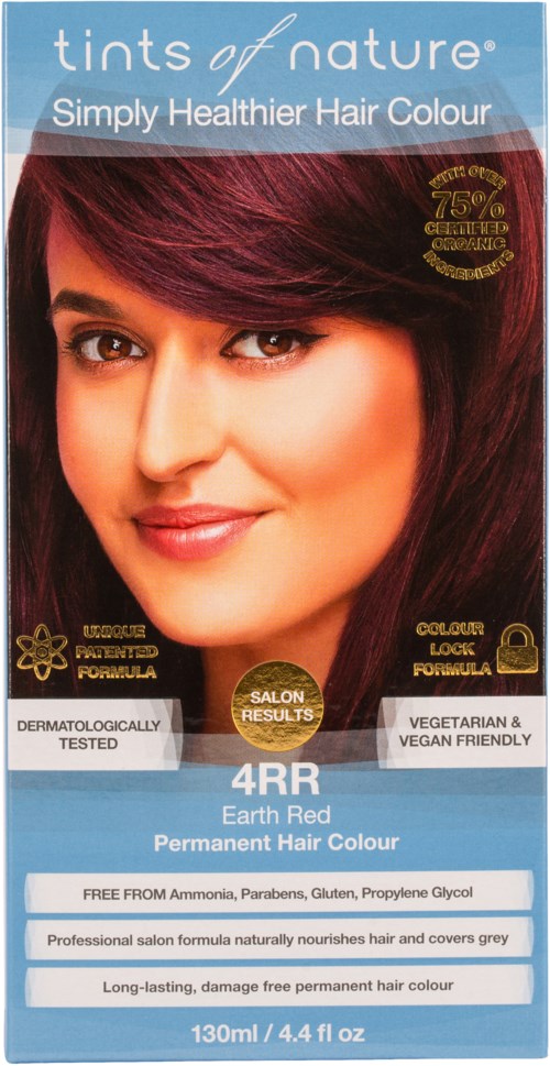 A hair dye package shows a woman with red hair, claiming healthier permanent hair color, free from chemicals, and vegan-friendly.