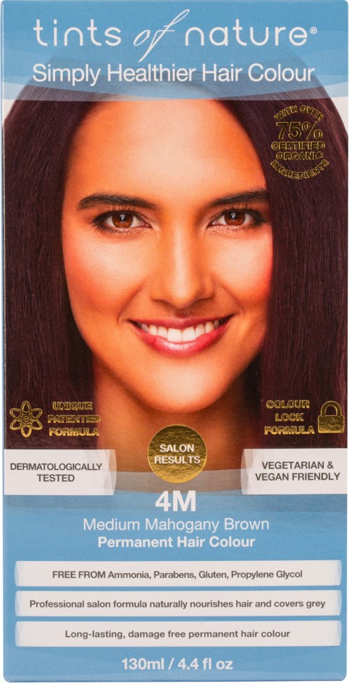 A hair dye box showing a smiling woman with long, brown hair. The box says it is natural, permanent, and vegan-friendly.