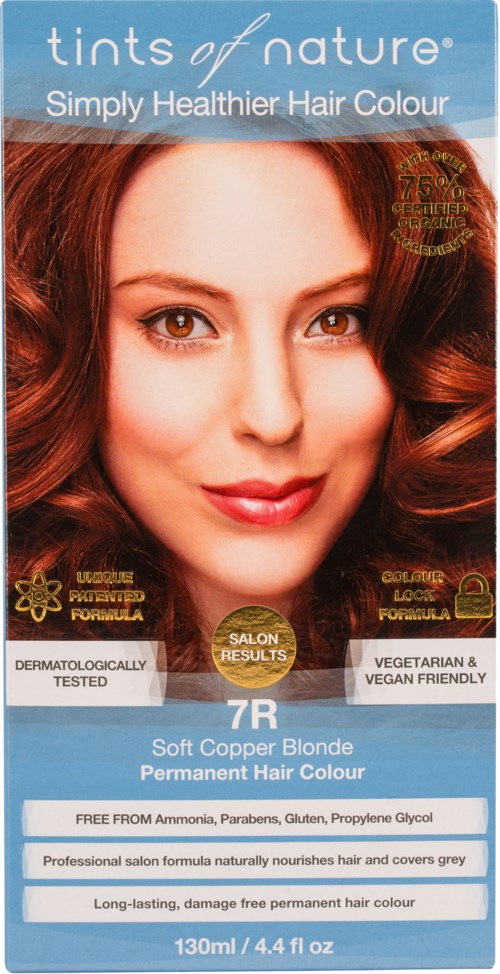 Redhead woman with shiny, curly hair on hair dye box. Packaging lists ingredients and benefits.