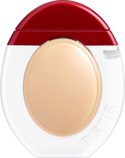 En liten enhet med rød topp, klar midtdel og stor beige knapp, designet for enkel bruk.
