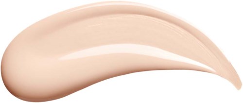A swirl of light pink foundation or cream on a black background.
