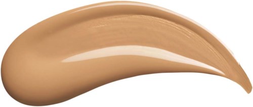 A dollop of beige liquid or cream on a black background, curved into a wave shape.