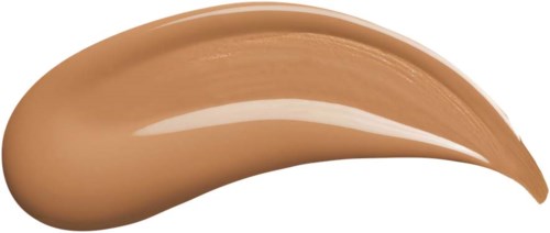 A beige-colored cream or lotion swatch with a smooth, curved shape and shiny surface.
