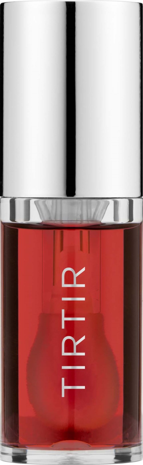 A small glass bottle with red liquid and a shiny silver cap, labeled "TIRTIR."