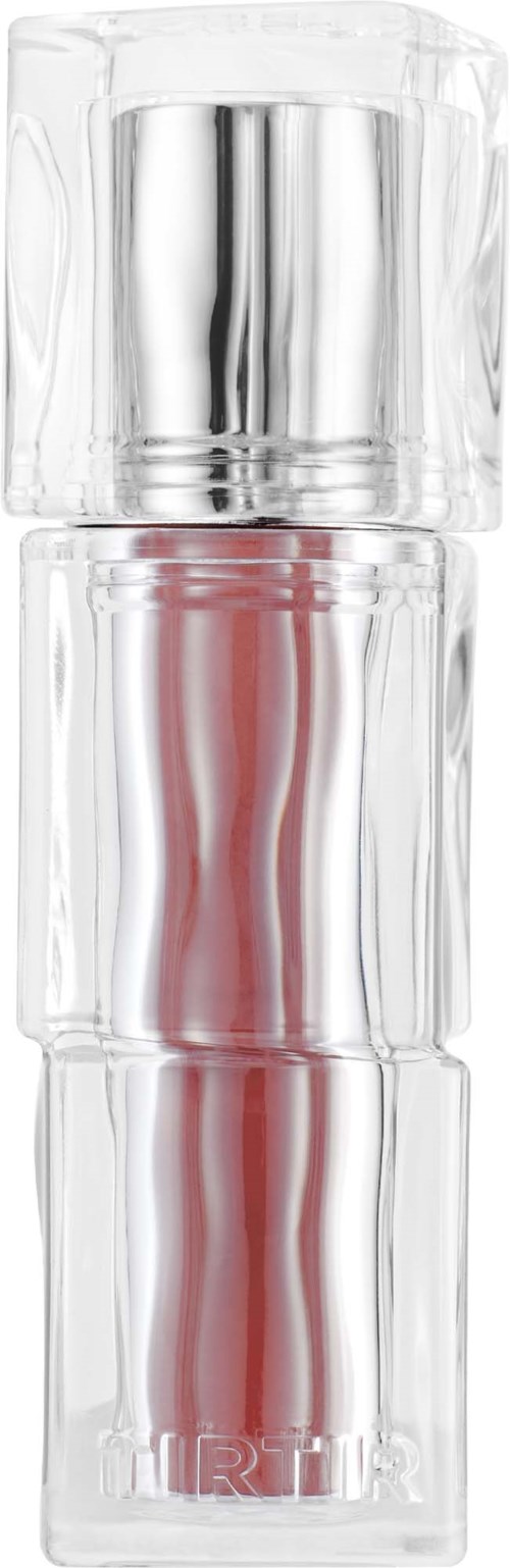 A clear cylindrical perfume bottle with a silver cap, containing pink liquid, named "HARTS".
