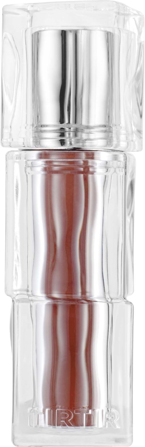 A clear cylindrical container with a silver top, possibly a perfume bottle, with some red design inside and branding at the bottom.