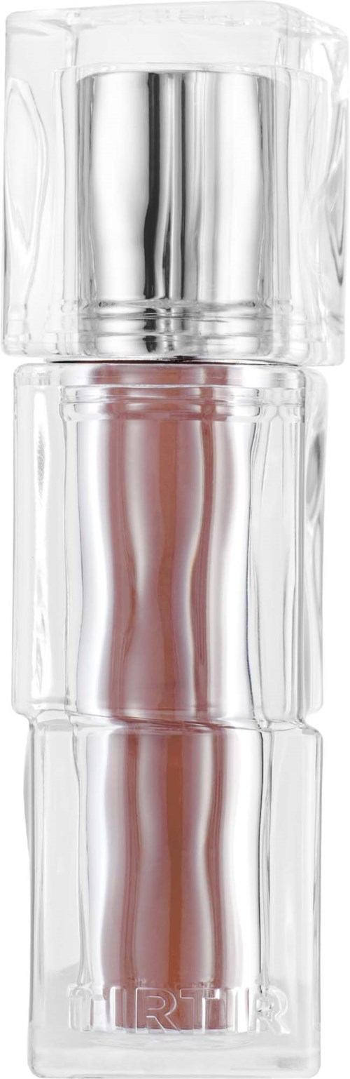 A clear glass container with a silver cap, likely a perfume or cosmetic bottle, stands vertically with a simple design.