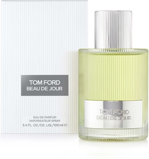 Eine Tom Ford Parfümflasche mit silberner Kappe, gelber Flüssigkeit und weißer Box mit grauem und schwarzem Text.