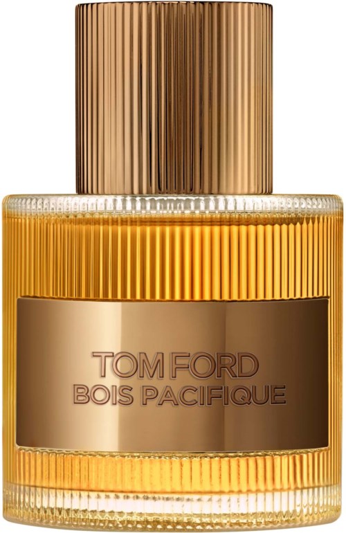 Een parfumfles met goud en brons kleuren, met een geribbelde dop en etiket met 'TOM FORD BOIS PACIFIQUE.'