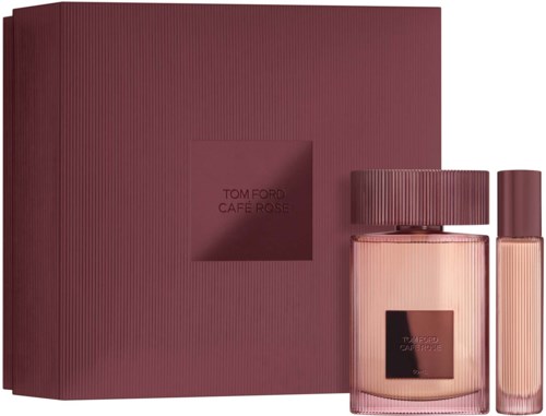 Een parfumsset met een grote doos en twee flessen, een grotere en een kleinere, in roze en paars tinten.