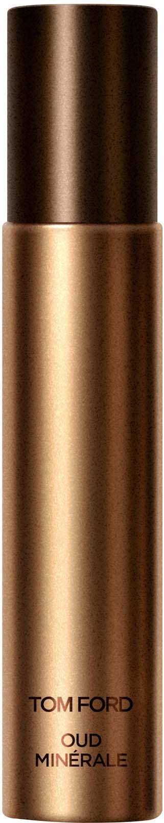 Een lange, cilindrische gouden fles met een bronze dop, met het label Tom Ford Oud Minérale, op een zwarte achtergrond.