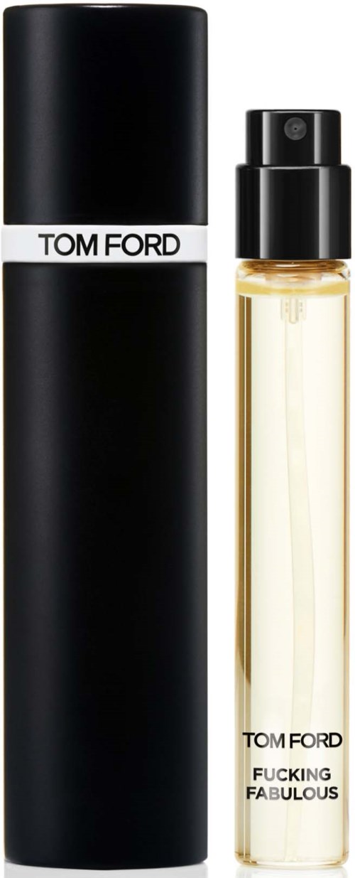 A perfume spray bottle labeled 'TOM FORD' and 'FUCKING FABULOUS' next to a tall black box.