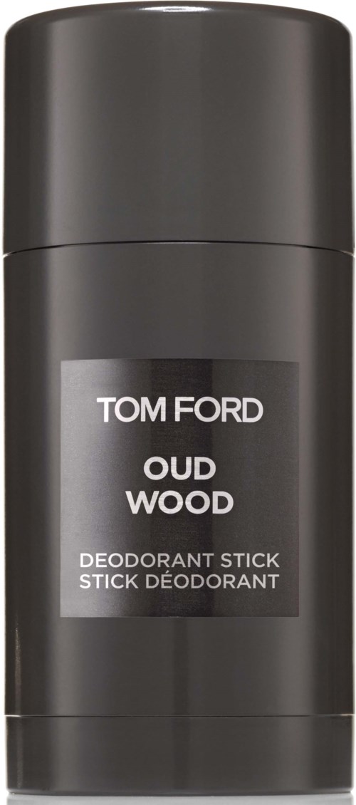 A black deodorant stick with a silver label says Tom Ford Oud Wood.