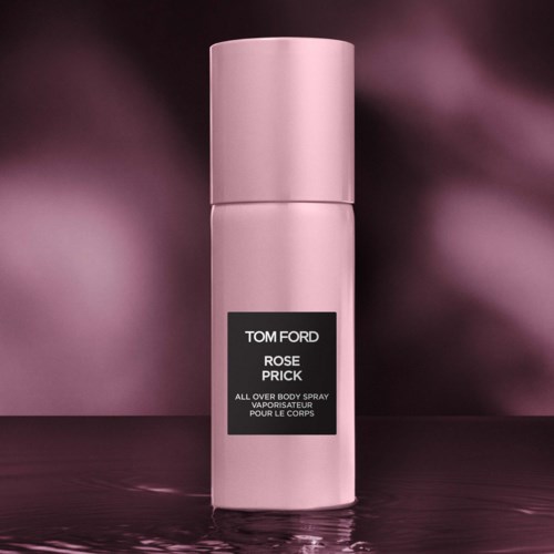 Pink spray bottle with black label, named Tom Ford Rose Prick, on dark pink background.