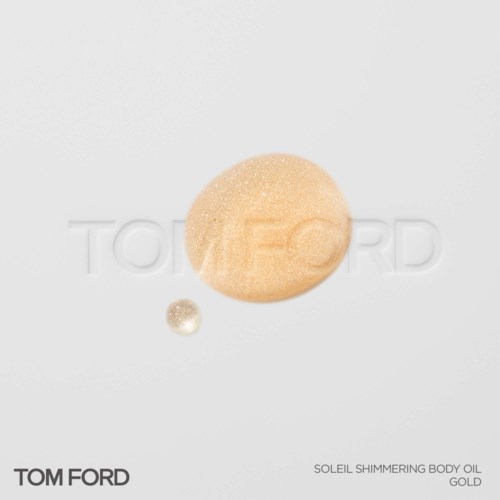 Twee ronde flessen Tom Ford Soleil Shimmering Body Oil, één groot en één klein, op een witte achtergrond.